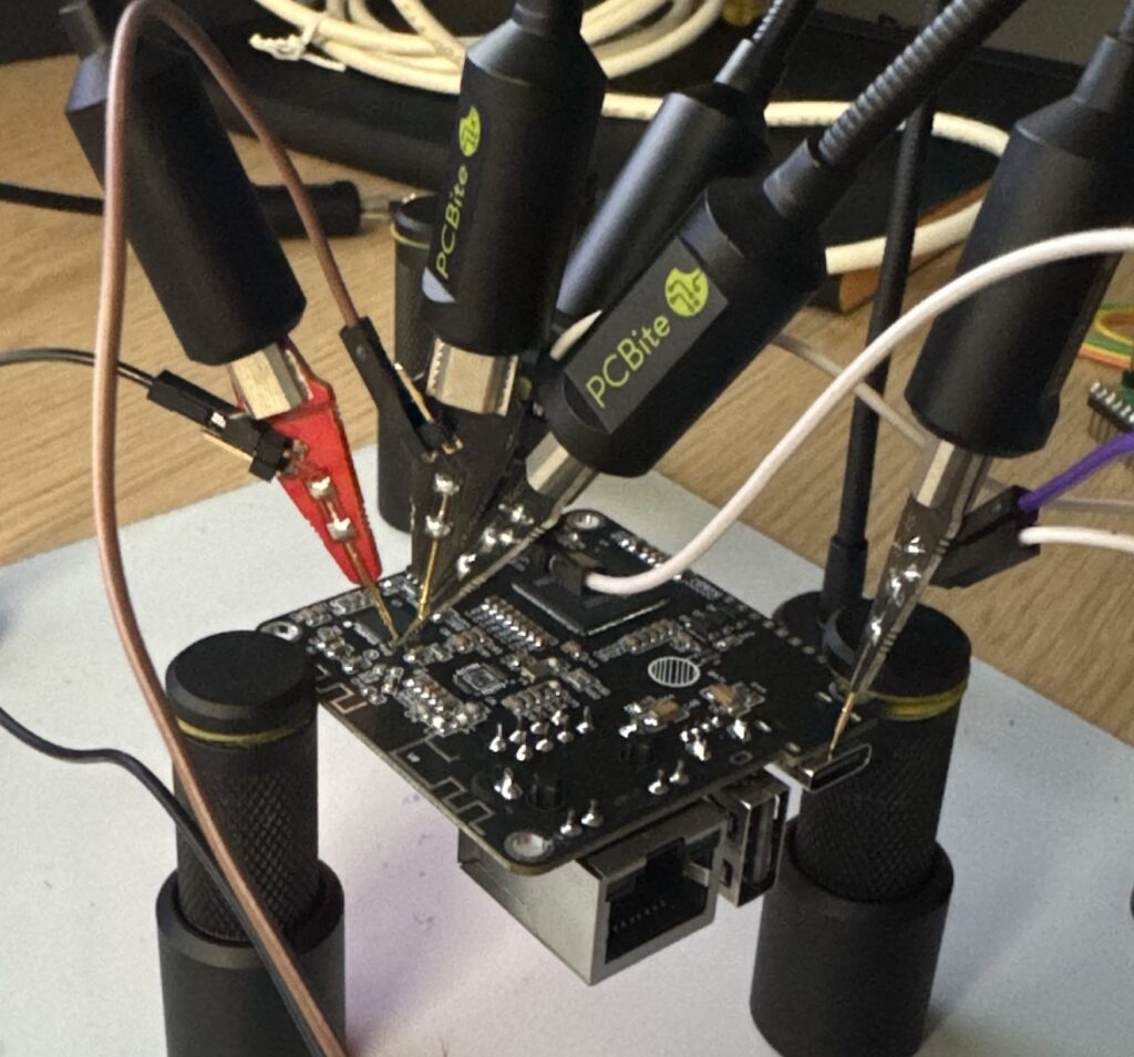 A picture of PCBites attached to the Barrot SoC's UART pins